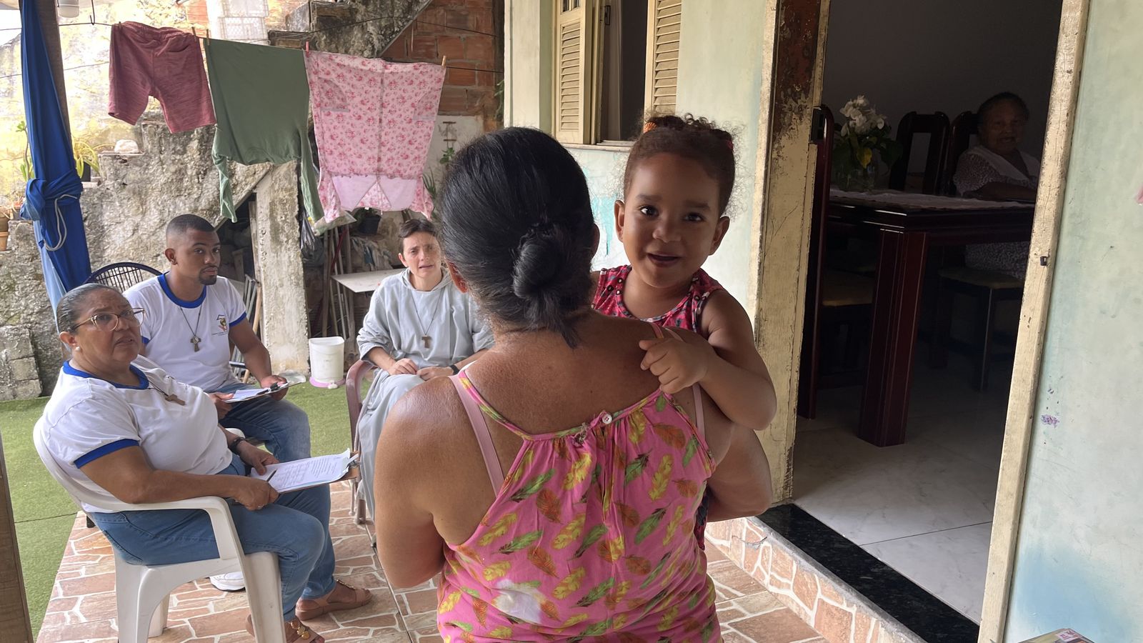 Talking with a family at their home